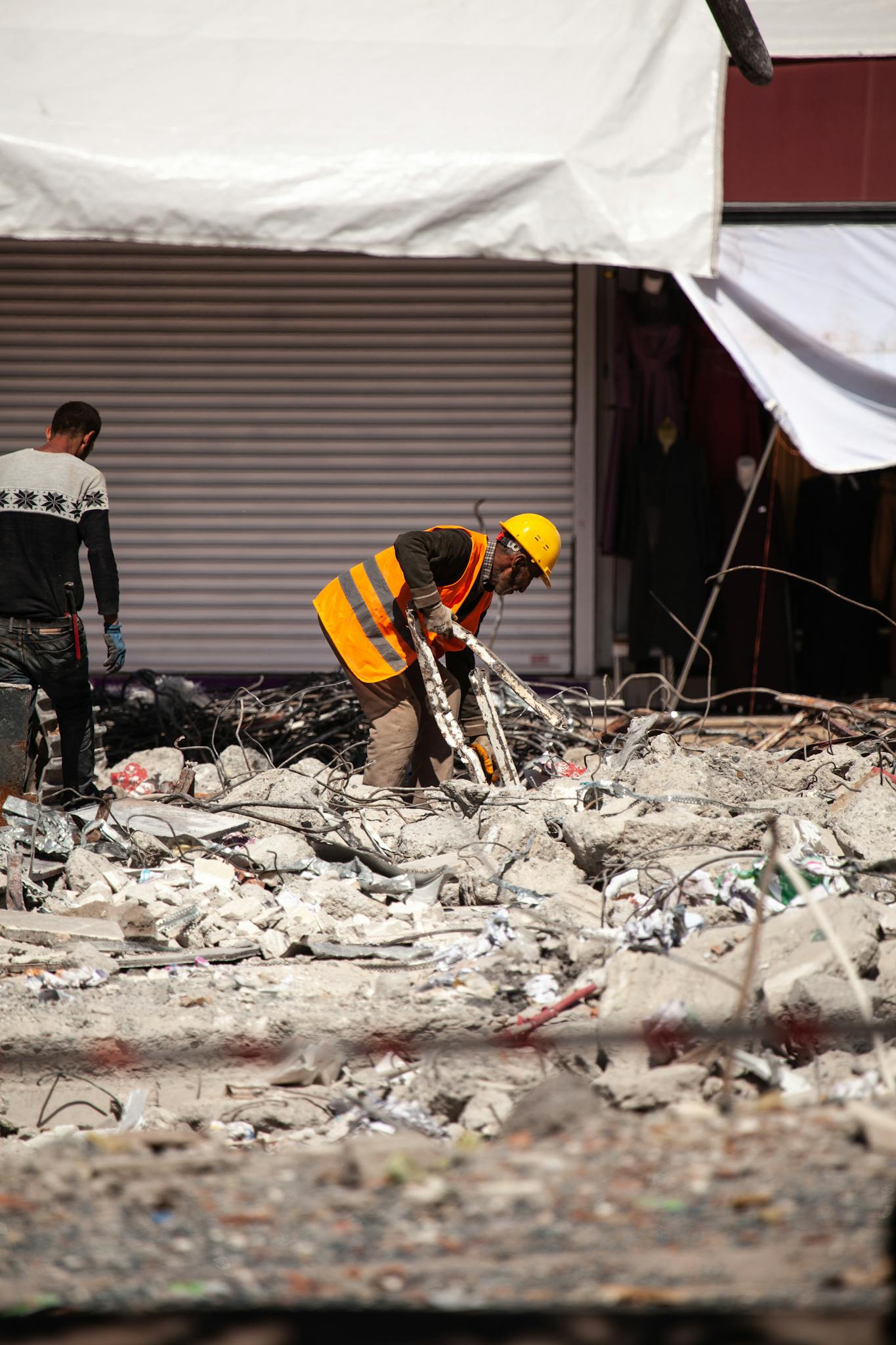 Massachusetts Fire Damage Restoration Services 3 Workers in reflective vests clear debris from